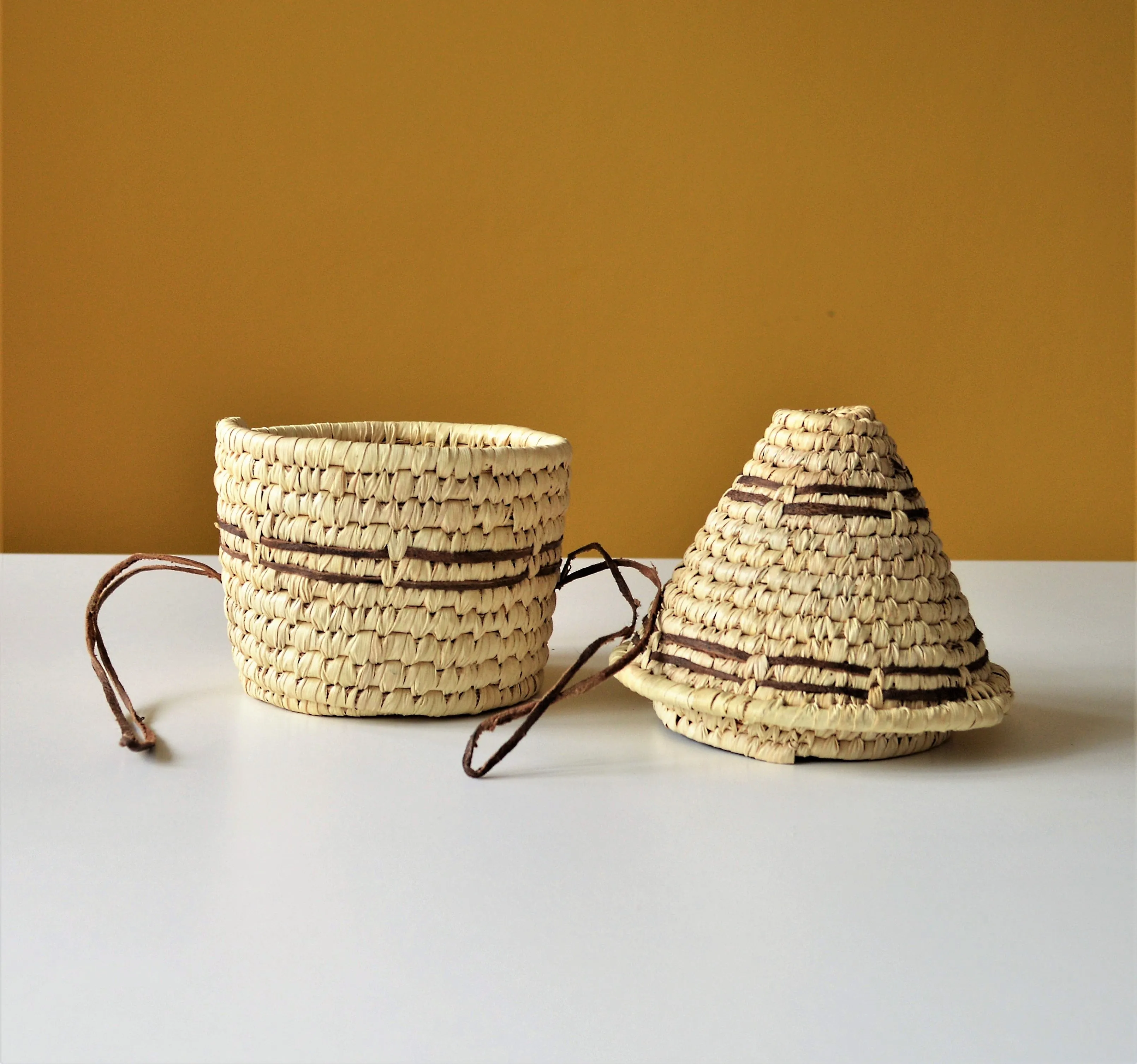 Woven palm leaf basket, Straw and leather wicker